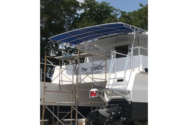 Slide: The Image of 2003 Gold Coast fast ferry under maintenance with scaffolding and blue canopy. - 6