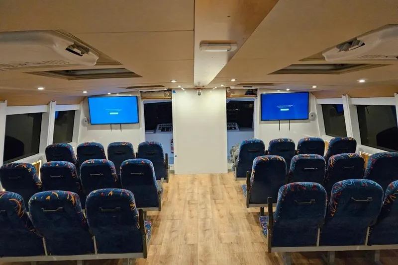 Slide: The Image of Interior of a 2003 Gold Coast fast ferry with seating and screens. - 8