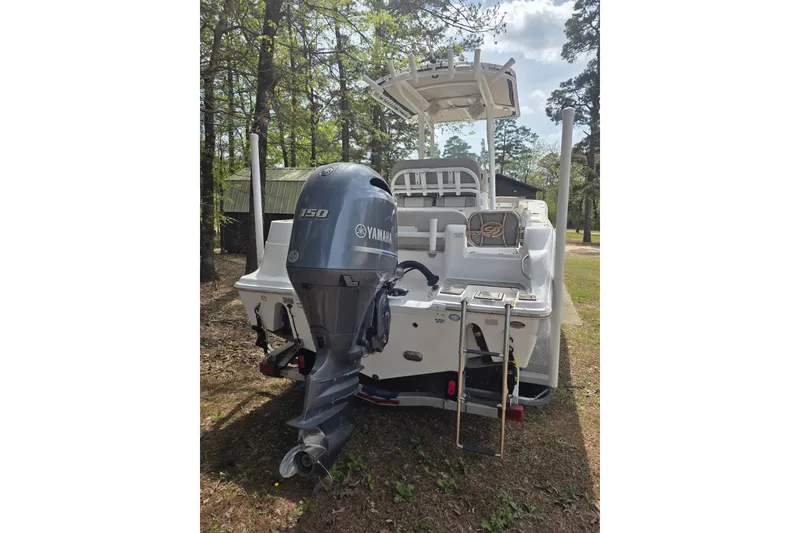 Slide: The Image of 2019 Sea Fox 226 Commander boat with Yamaha 150 engine, parked outdoors. - 4