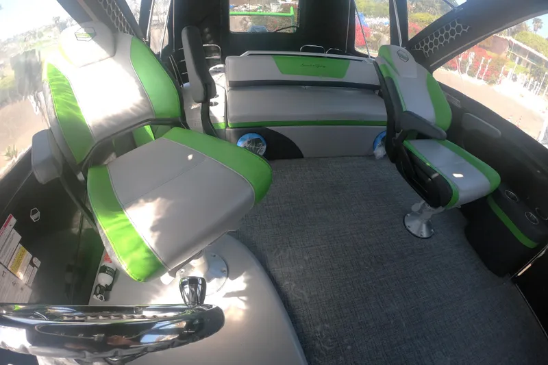 Slide: The Image of Interior of 2023 South Bay 525UL AR boat with green and gray seating. - 16