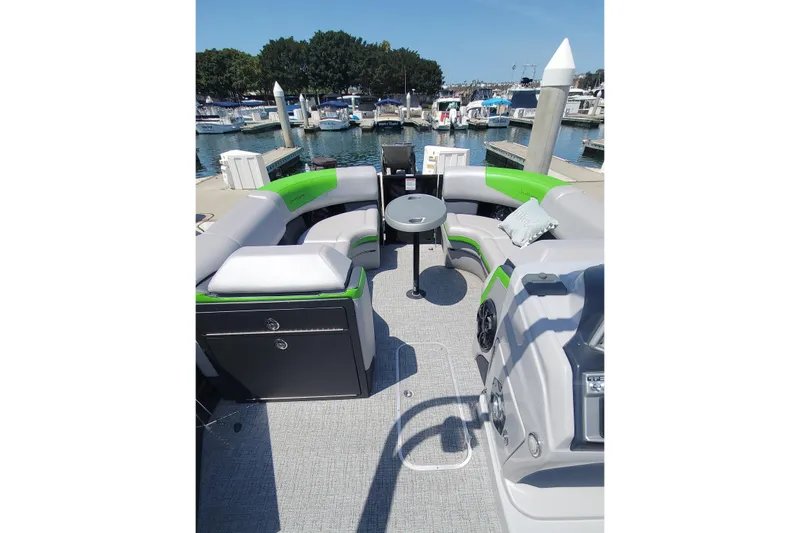 Slide: The Image of Luxurious 2023 South Bay 525UL AR pontoon boat interior at marina dock. - 3