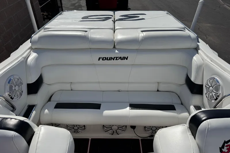 Slide: The Image of 2004 Fountain 35 Executioner boat interior with white leather seating and speaker system. - 10