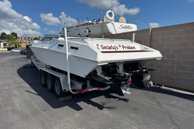 Slide: The Image of 2004 Fountain 35 Executioner boat on trailer, labeled "Society's Problem," parked outdoors. - 3