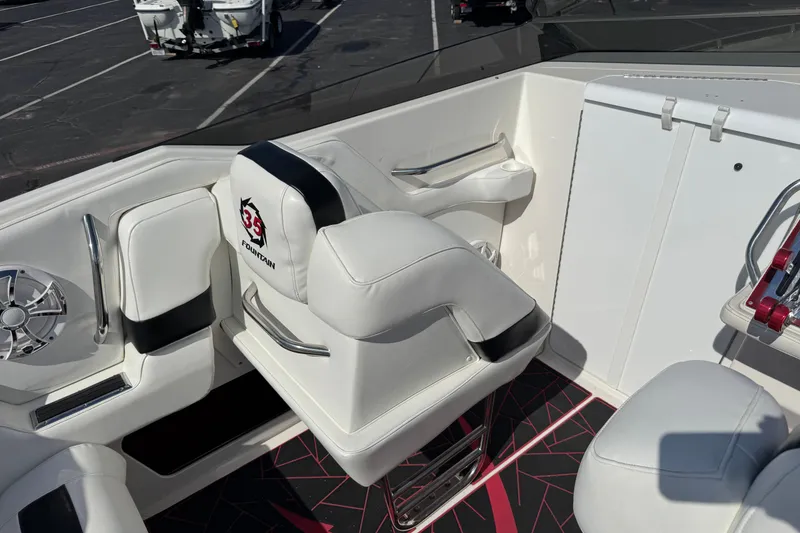 Slide: The Image of 2004 Fountain 35 Executioner boat interior with white seating and modern design. - 6