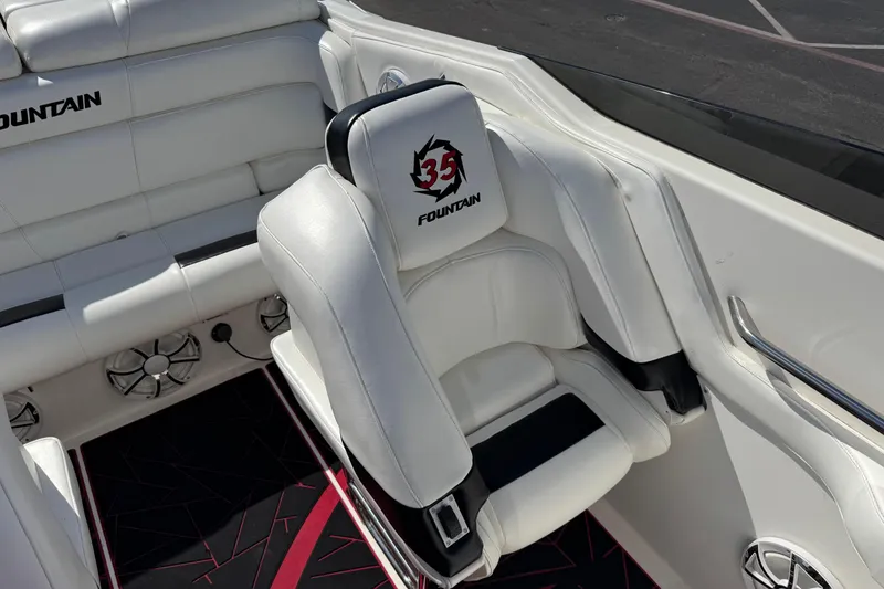 Slide: The Image of White leather seating in a 2004 Fountain 35 Executioner boat interior. - 8