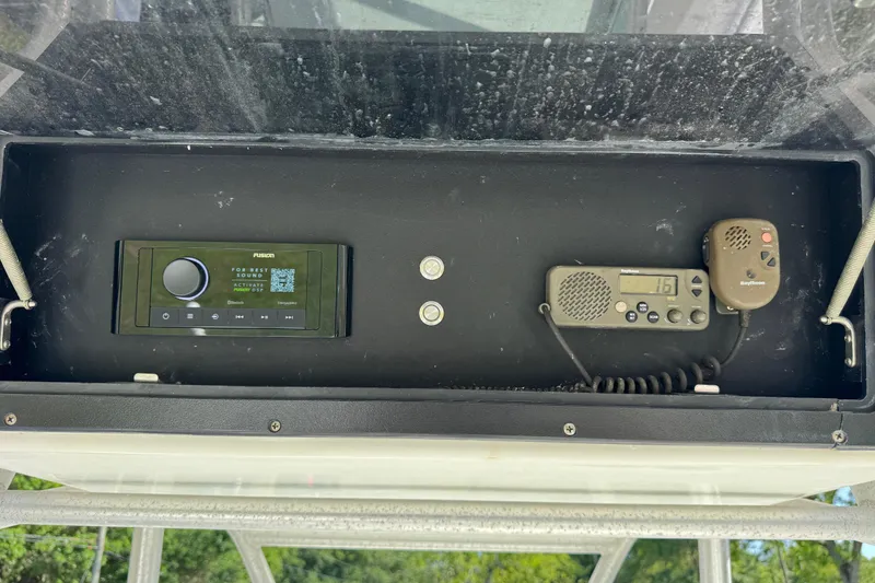 Slide: The Image of Control panel of a 2000 Regulator 26 Forward Seating boat with radio and speaker system. - 10