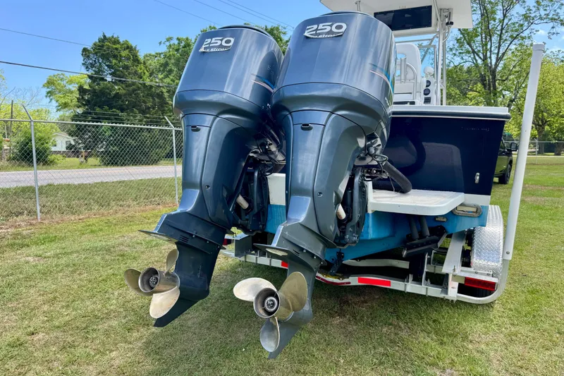 Slide: The Image of Twin 250 horsepower outboard engines on a 2000 Regulator 26 Forward Seating boat. - 4