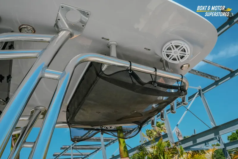 Slide: The Image of 2020 Key West 219 FS boat with stainless steel frame and speaker, outdoor setting. - 10