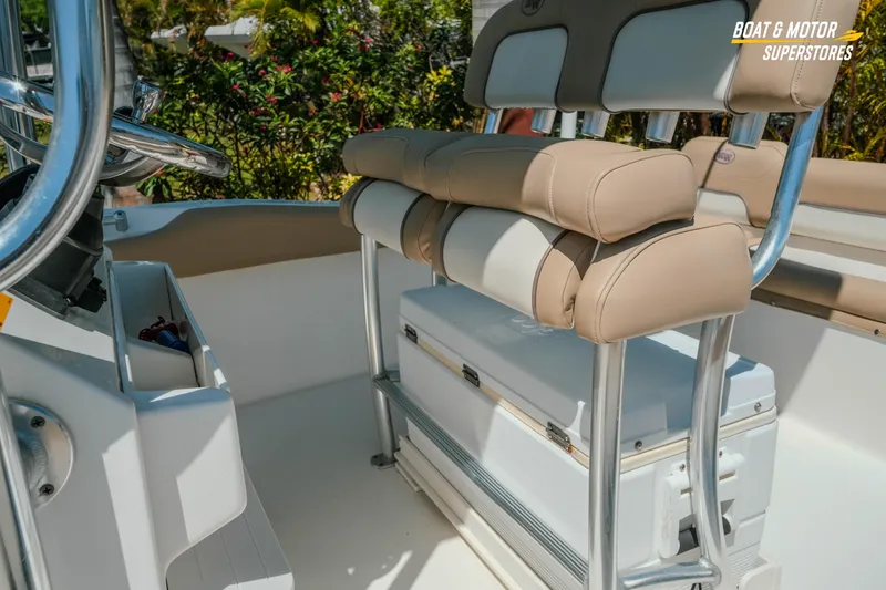 Slide: The Image of 2020 Key West 219 FS boat interior with cushioned seating and storage. - 11