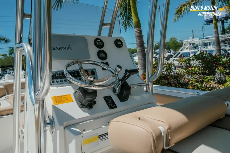 Slide: The Image of 2020 Key West 219 FS boat dashboard with Garmin navigation system and steering wheel. - 14