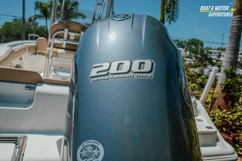Slide: The Image of 2020 Key West 219 FS boat with 200 horsepower engine, outdoor setting. - 5
