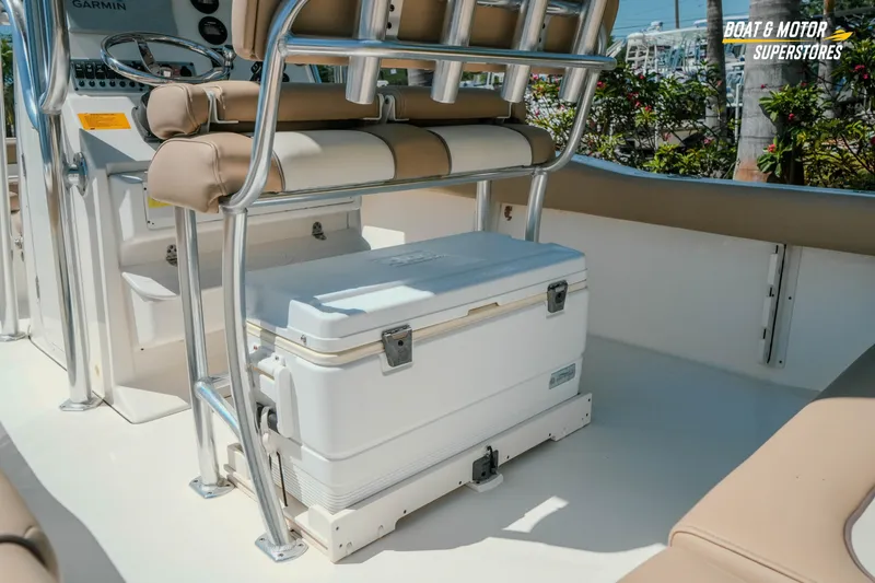 Slide: The Image of 2020 Key West 219 FS boat interior with seating and cooler storage. - 8