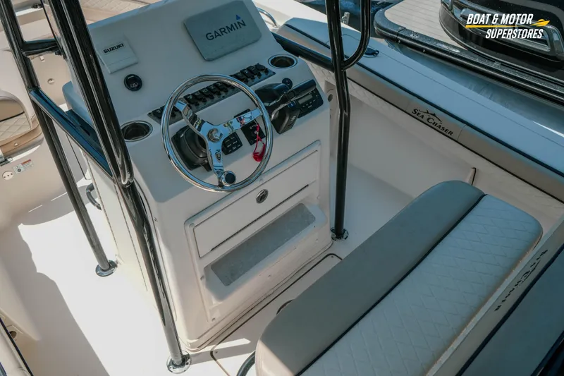 Slide: The Image of 2020 Sea Chaser 22 HFC boat console with Garmin navigation and Suzuki controls. - 13