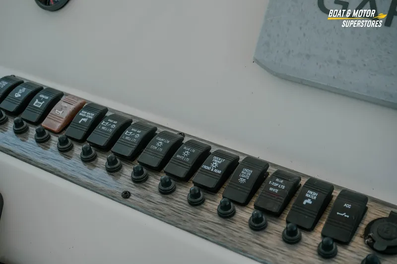 Slide: The Image of Control panel of a 2020 Sea Chaser 22 HFC boat with labeled switches. - 15