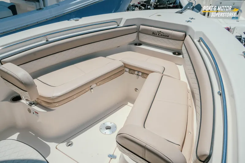 Slide: The Image of 2020 Sea Chaser 22 HFC boat interior with beige seating and stainless steel accents. - 17