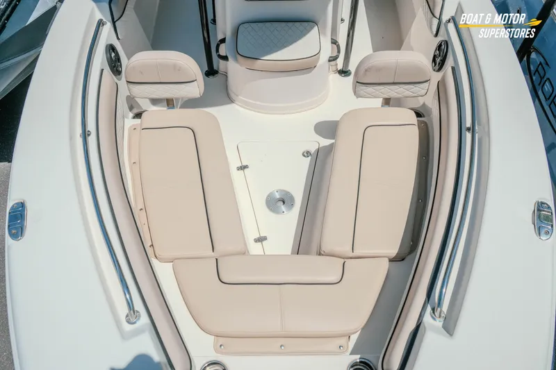 Slide: The Image of 2020 Sea Chaser 22 HFC boat interior with beige seating and stainless steel railings. - 18