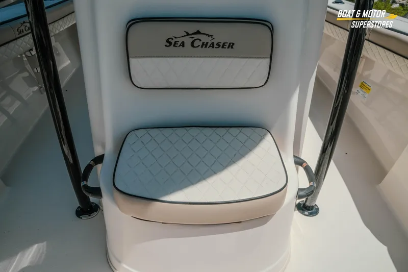 Slide: The Image of 2020 Sea Chaser 22 HFC boat seat with logo, featuring diamond-patterned upholstery. - 20