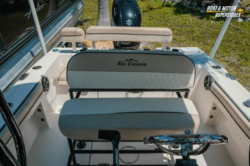 Slide: The Image of 2020 Sea Chaser 22 HFC boat interior with seating and steering wheel. - 22