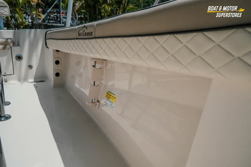 Slide: The Image of 2020 Sea Chaser 22 HFC boat interior with padded side panel and rod holders. - 23