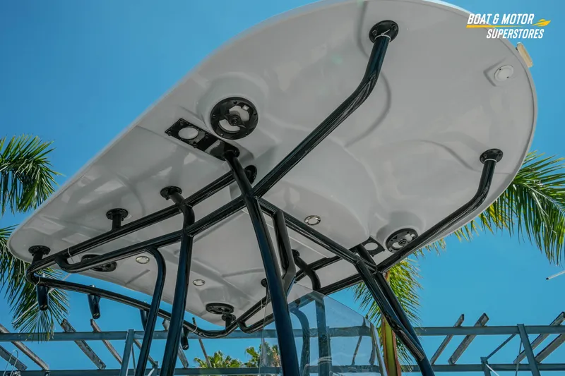 Slide: The Image of 2020 Sea Chaser 22 HFC boat canopy against a clear blue sky with palm trees. - 3