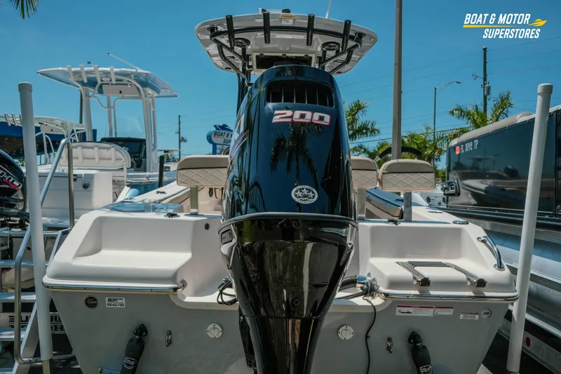 Slide: The Image of 2020 Sea Chaser 22 HFC boat with powerful 200 HP engine displayed outdoors. - 6