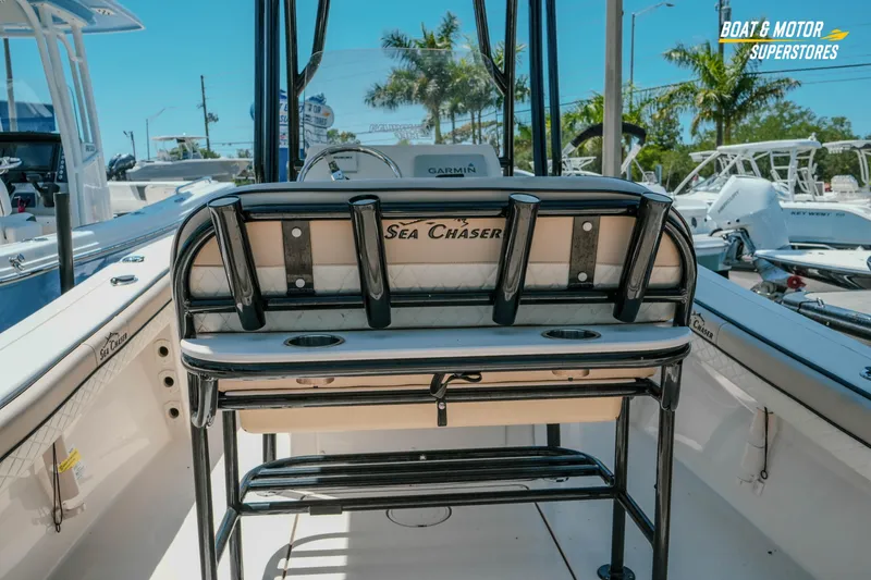 Slide: The Image of 2020 Sea Chaser 22 HFC boat interior with rod holders and seating. - 9