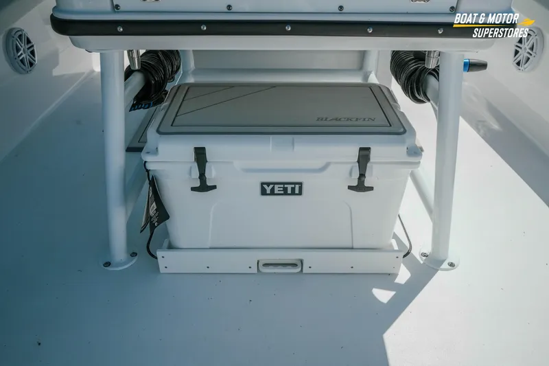 Slide: The Image of YETI cooler on 2026 Blackfin 242 HB boat deck, Boat & Motor Superstores. - 10