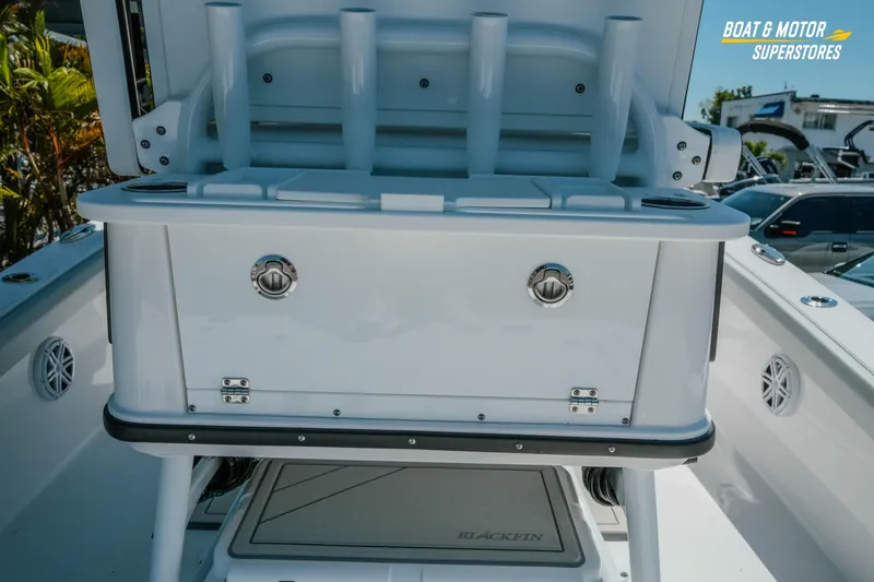 Slide: The Image of 2026 Blackfin 242 HB boat interior with storage and rod holders. - 11