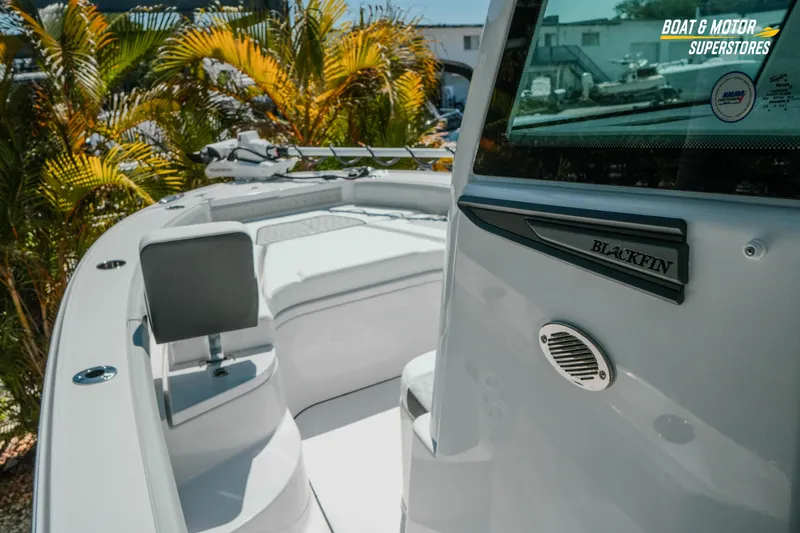 Slide: The Image of 2026 Blackfin 242 HB boat interior with seating and sleek design. - 17