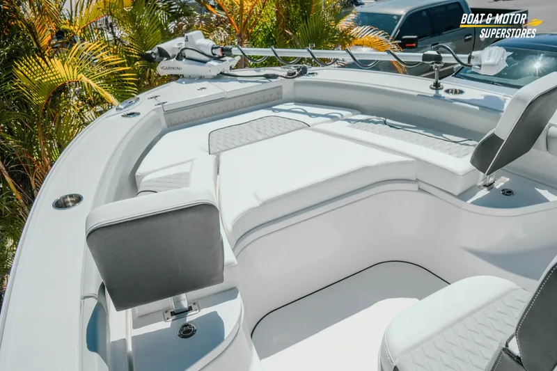 Slide: The Image of 2026 Blackfin 242 HB boat interior with seating and Garmin equipment. - 18