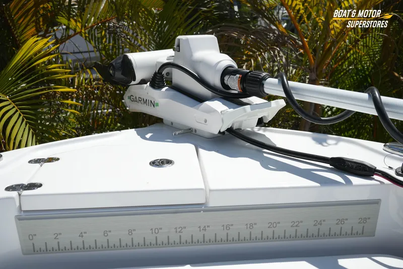 Slide: The Image of 2026 Blackfin 242 HB boat with Garmin equipment, surrounded by tropical foliage. - 19
