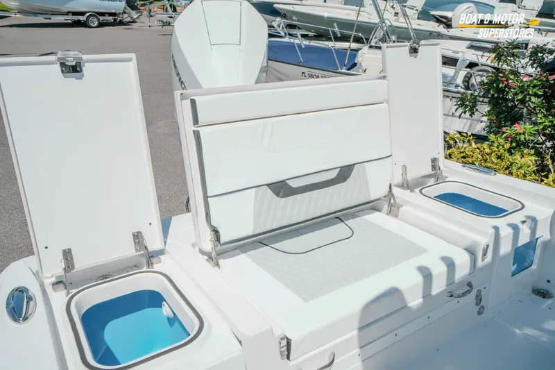 Slide: The Image of 2026 Blackfin 242 HB boat with open storage compartments and seating area. - 30