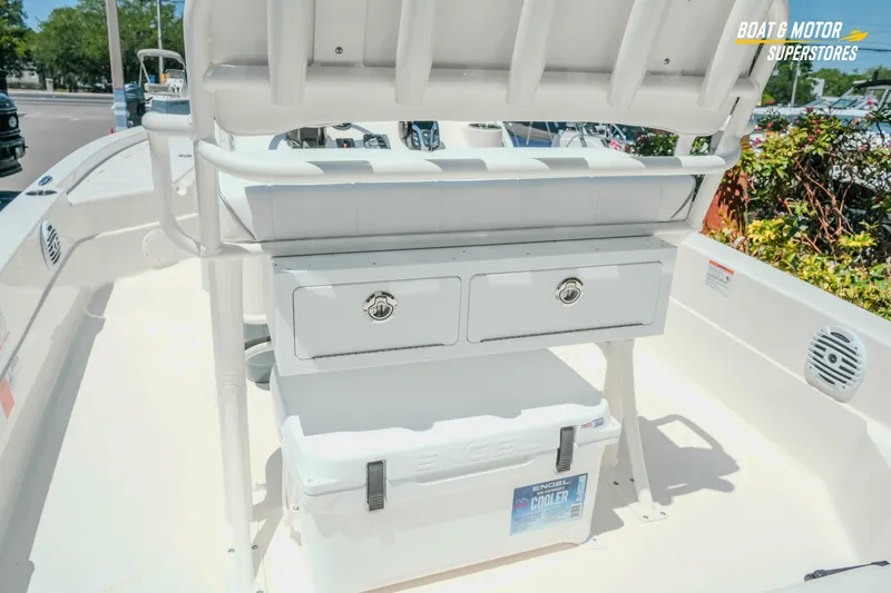 Slide: The Image of 2026 Skeeter SX221 boat interior with storage compartments and cooler. - 12
