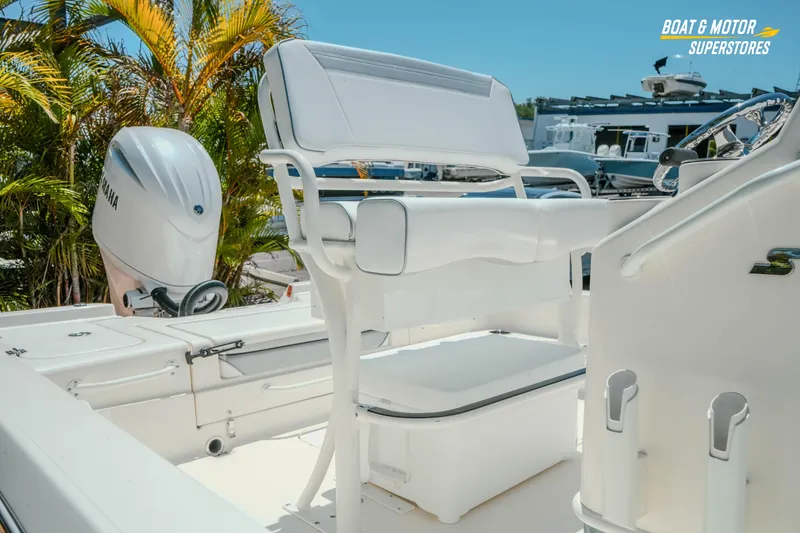 Slide: The Image of 2026 Skeeter SX221 boat interior with Yamaha engine, featuring white seating and console. - 8
