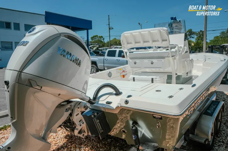 Slide: The Image of 2026 Skeeter SX221 boat with Yamaha engine displayed at dealership. - 9