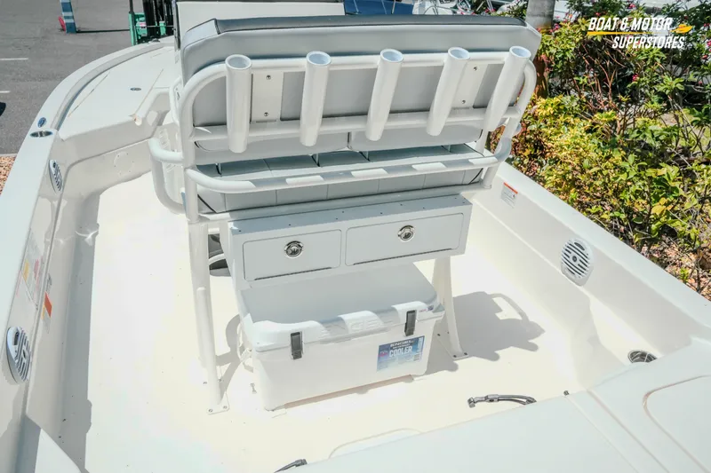 Slide: The Image of 2026 Skeeter SX221 boat interior with rod holders and storage compartments. - 11