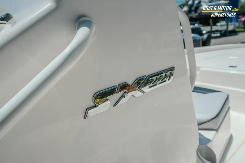 Slide: The Image of 2026 Skeeter SX221 boat logo on sleek white surface, showcasing modern design. - 18