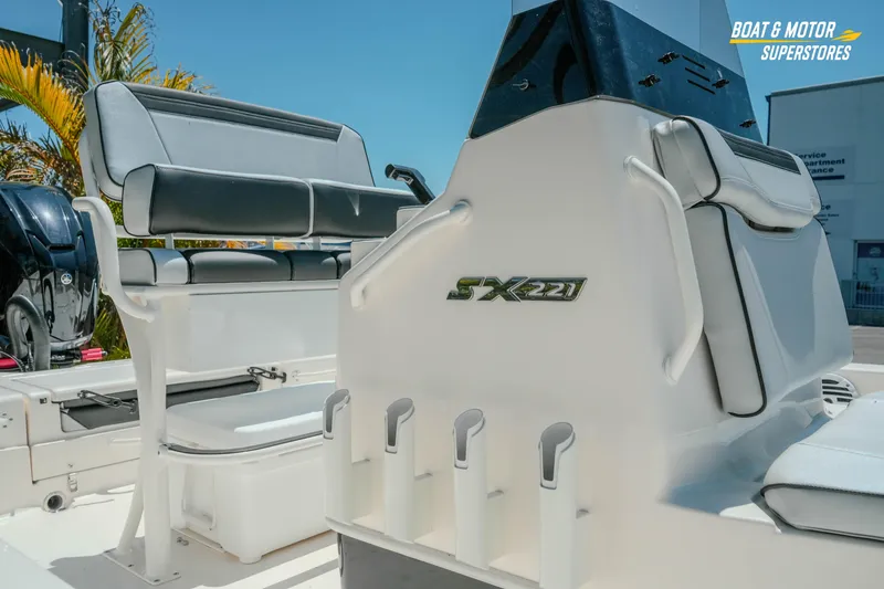 Slide: The Image of 2026 Skeeter SX221 boat interior with seating and rod holders, showcased at Boat & Motor Superstores. - 6
