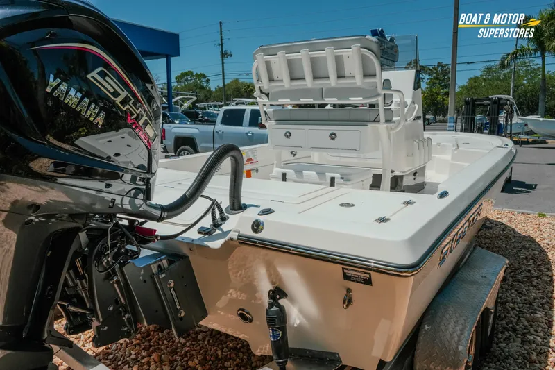 Slide: The Image of 2026 Skeeter SX221 boat with Yamaha engine at dealership, showcasing sleek design and features. - 8