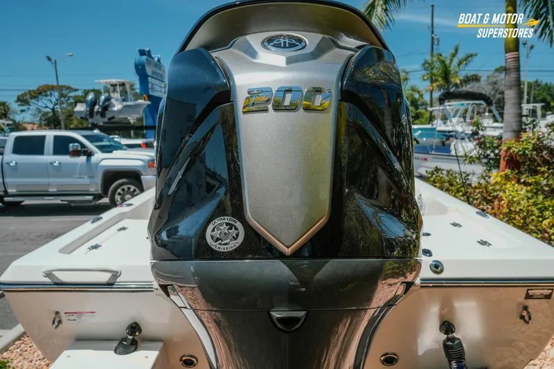 Slide: The Image of 2026 Skeeter SX221 boat with powerful 200 HP engine in outdoor setting. - 9