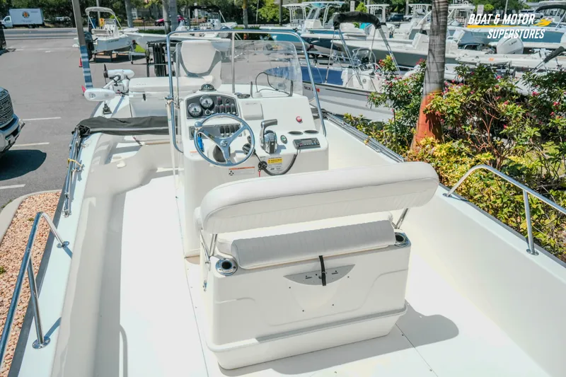 Slide: The Image of 2016 Boston Whaler 210 Montauk boat interior with steering console and seating. - 11