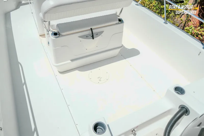 Slide: The Image of 2016 Boston Whaler 210 Montauk boat interior with seating and storage. - 12