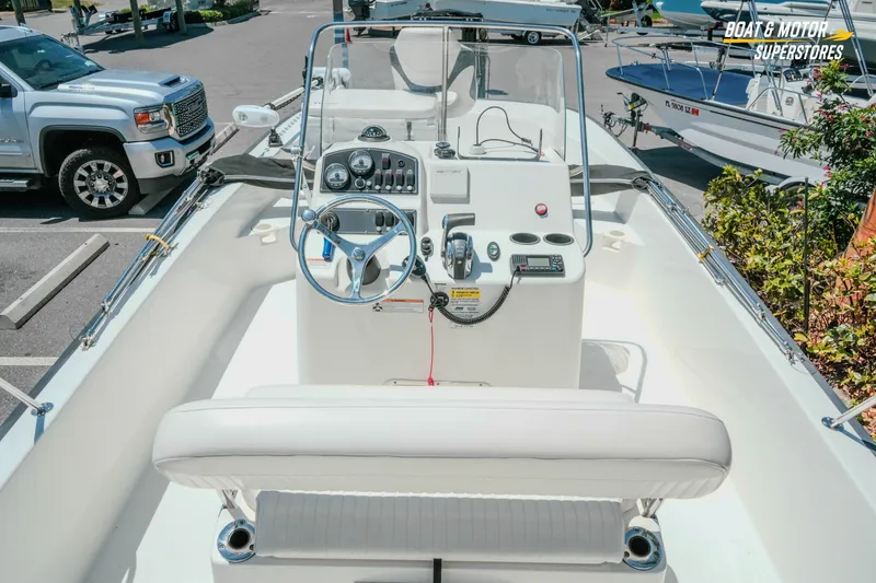 Slide: The Image of 2016 Boston Whaler 210 Montauk boat interior with steering console and seating. - 14