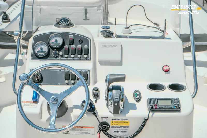 Slide: The Image of Control panel of a 2016 Boston Whaler 210 Montauk boat with steering wheel and gauges. - 15