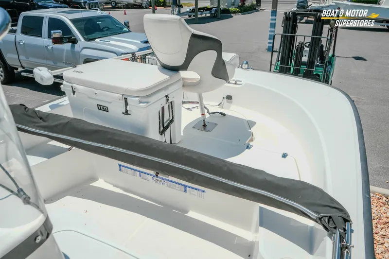 Slide: The Image of 2016 Boston Whaler 210 Montauk boat interior with Yeti cooler and seating. - 17