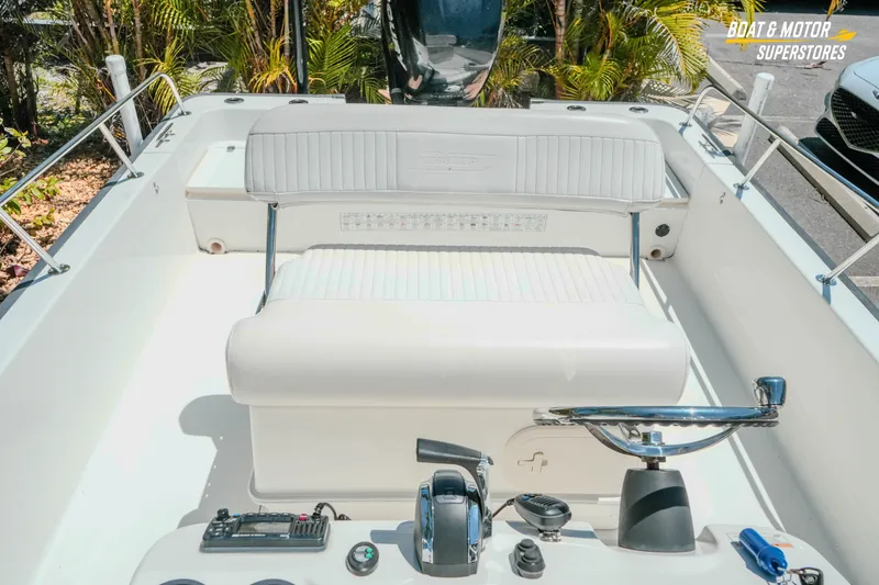 Slide: The Image of 2016 Boston Whaler 210 Montauk boat interior with seating and control panel. - 23