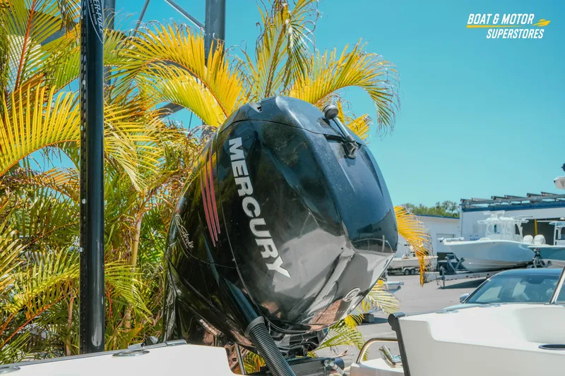 Slide: The Image of 2016 Boston Whaler 210 Montauk with Mercury engine, surrounded by tropical plants. - 7