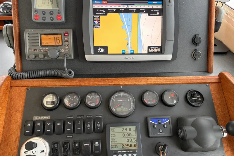 Slide: The Image of Nordic Tug 32 (2007) dashboard with navigation and control instruments, including Garmin GPS. - 3