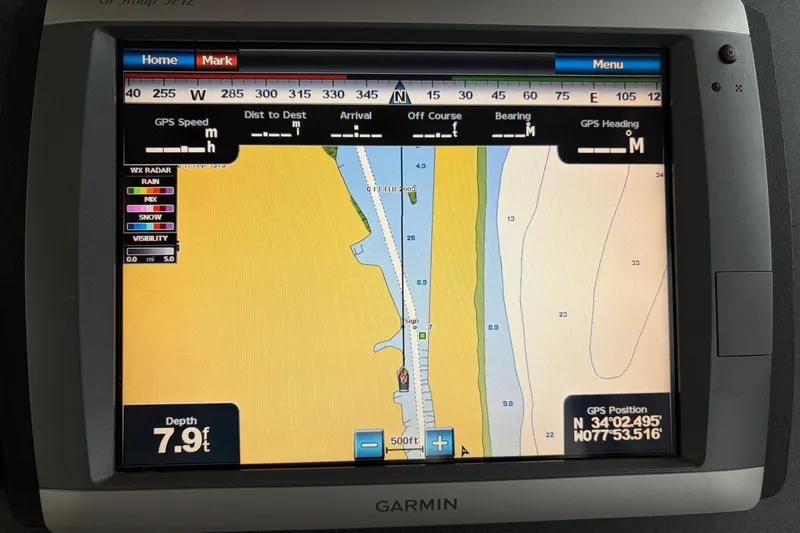 Slide: The Image of Garmin GPS display on 2007 Nordic Tug 32, showing navigation map and depth. - 5