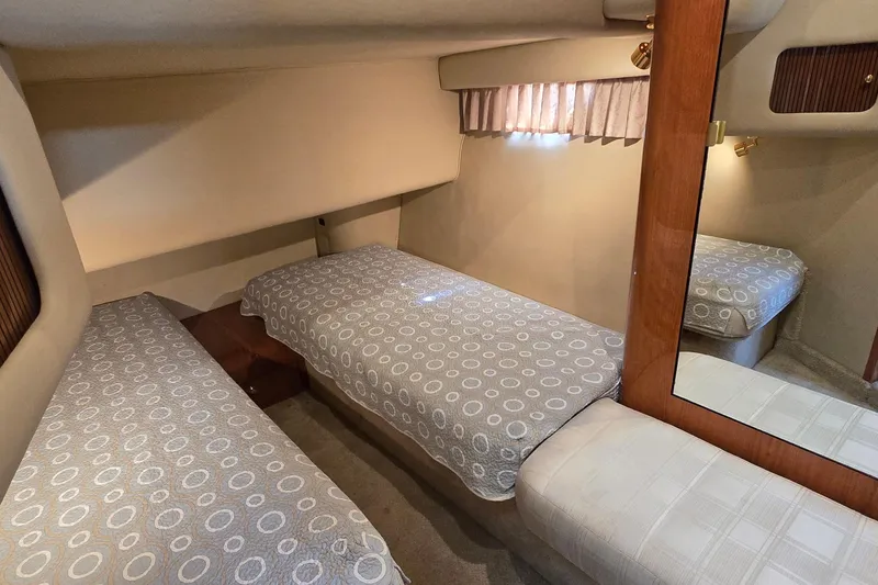 Slide: The Image of Luxurious interior of a 2001 Sea Ray 400 Sedan Bridge yacht with elegant wood flooring. - 12